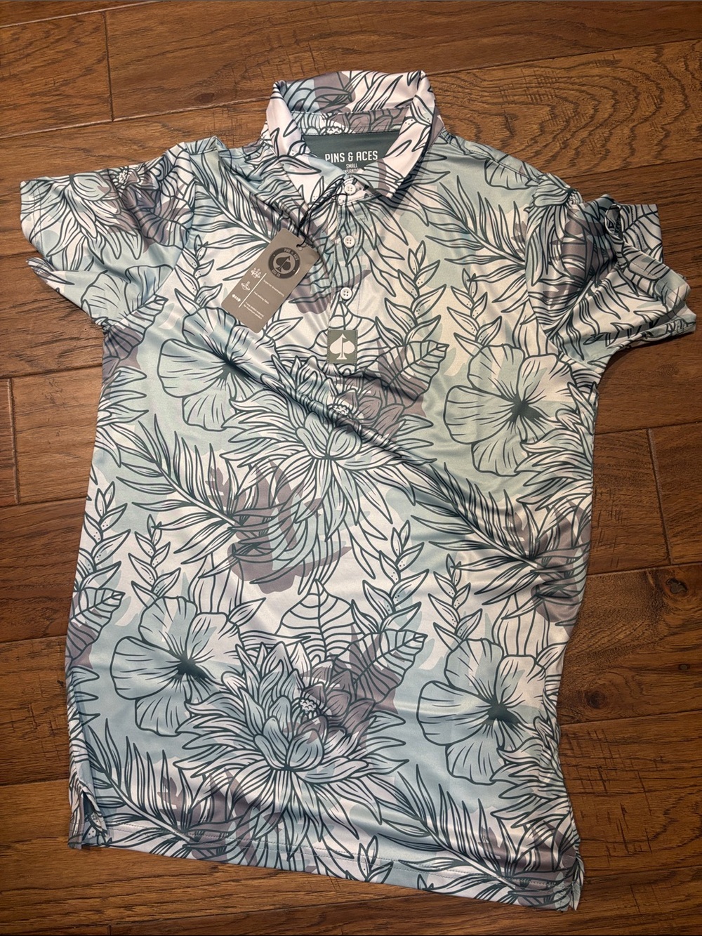 Pins and Aces Men's Light Blue Floral Golf Polo